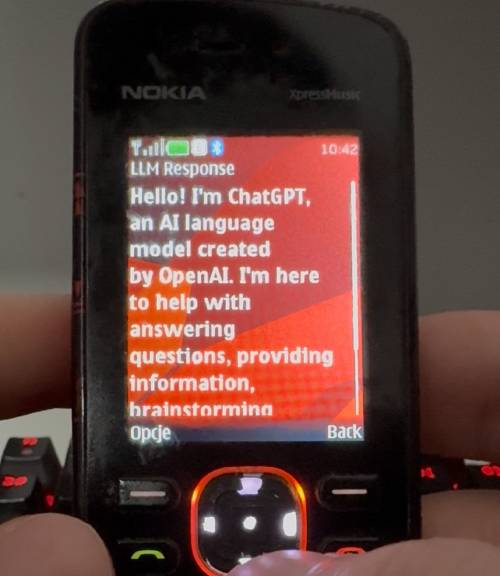 photo of nokia 5220 xpress music running tinyllm application with the response from ChatGPT "Hello i'm chatgpt an AI language model..."